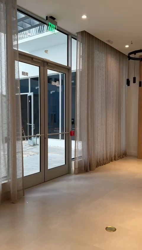 Clean full-height entrance glazing after window service